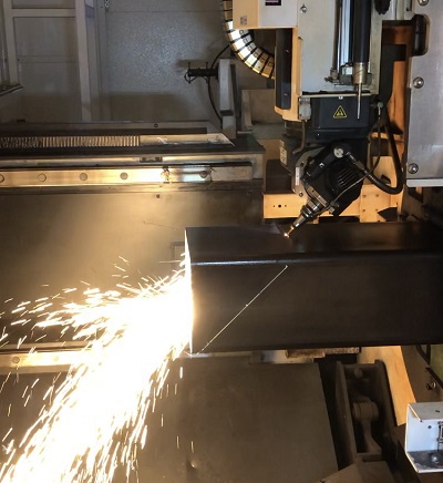 Square tube being cut with laser