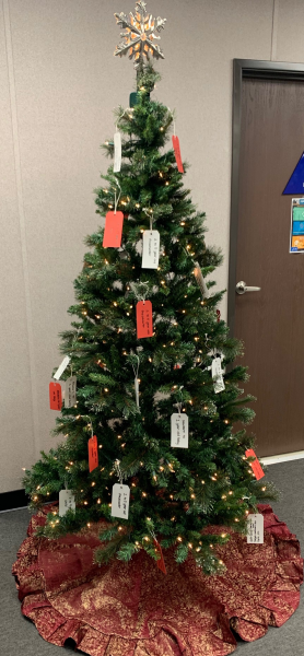 Christmas tree with gift tags on it
